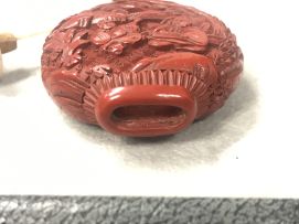A Chinese carved red lacquer snuff bottle, Qing dynasty, 18th/19th century