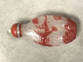 A Chinese single overlay red snowflake glass snuff bottle, Qing Dynasty, 19th century