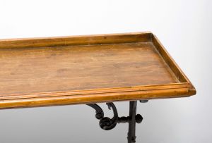 A Victorian cast-iron and pine table