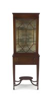 An Edwardian mahogany and inlaid cabinet-on-stand