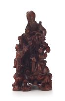 A Chinese hardwood carving of Shou-lao and children, 20th century