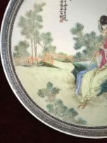 A pair of Chinese famille-rose wall plates, 20th century