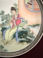 A pair of Chinese famille-rose wall plates, 20th century