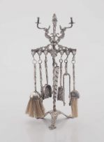 A silver miniature model of a fire iron stand, late 19th century