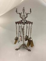 A silver miniature model of a fire iron stand, late 19th century