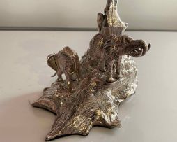 A silver cast 'Root Tree & Elephant' candle holder, Patrick Mavros, Harare, 2001