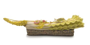 A Chinese stained ivory carving of a cabbage leaf, early 20th century