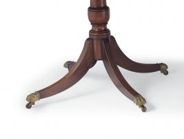 A George III style mahogany triple pedestal extending dining table