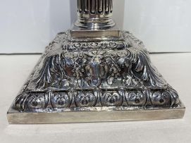 A pair of George III silver Corinthian candlesticks, Emick Romer, London, 1762