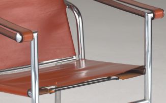 An LC1 leather and chrome armchair designed in 1928 by Le Corbusier, Pierre Jeannert and Charlotte Periand