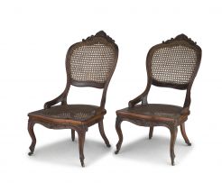 A pair of fruitwood and caned salon chairs