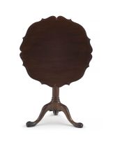 A George III mahogany tilt-top pie-crust table