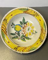 A faience yellow, green, blue and brown dish, 18th century