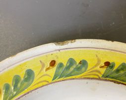 A faience yellow, green, blue and brown dish, 18th century