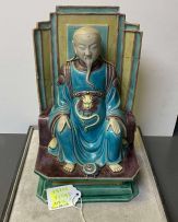 A Chinese Ming style stoneware figure of an Immortal, 19th century