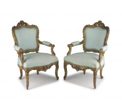 A pair of Louis XV style giltwood and upholstered armchairs, 19th century