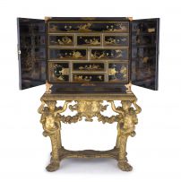A black japanned and chinoiserie decorated brass-mounted cabinet-on-stand, 19th century