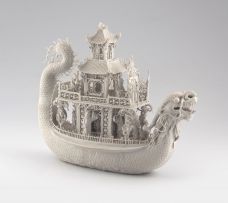 A Chinese biscuit porcelain model of a dragon boat, Qing Dynasty, late 19th century