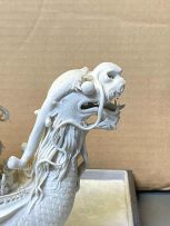 A Chinese biscuit porcelain model of a dragon boat, Qing Dynasty, late 19th century