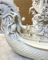 A Chinese biscuit porcelain model of a dragon boat, Qing Dynasty, late 19th century