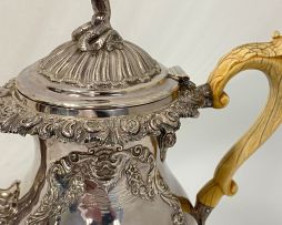 A George IV silver hot water jug, Hyam Hyams, London, 1828