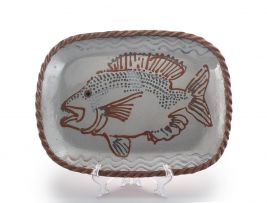 An earthenware-glazed dish, Juliet Armstrong, late 20th century