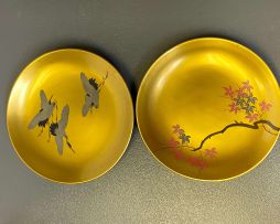 A set of seven Japanese red and gilt lacquer bowls and saucer dishes