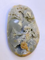 A Chinese celadon and russet jade carving of a boulder, Qing Dynasty, 19th century