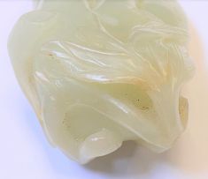 A Chinese pale celadon jade carving of a finger citron, Qing Dynasty, 19th century