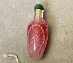 A Chinese pink glass 'cabbage' snuff bottle, Qing Dynasty, 19th century