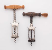 A spring loaded steel corkscrew, late 19th century