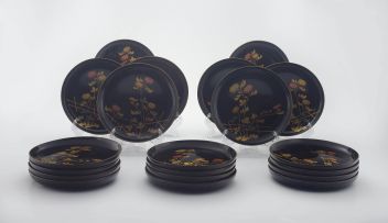 A set of twenty Japanese black lacquer dishes