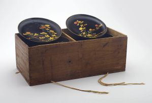 A set of twenty Japanese black lacquer dishes