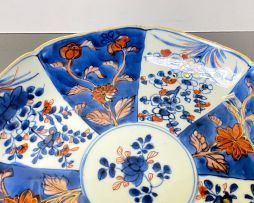 A pair of Chinese blue and white 'clobbered' dishes, Qianlong period, 1735-1796 and later