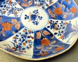 A pair of Chinese blue and white 'clobbered' dishes, Qianlong period, 1735-1796 and later