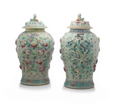 A near pair of Chinese famille-verte jars and covers, 20th century