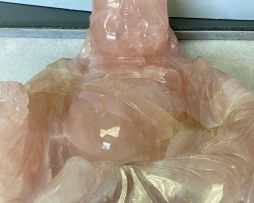 A Chinese pink quartz figure of Buddha