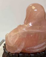 A Chinese pink quartz figure of Buddha