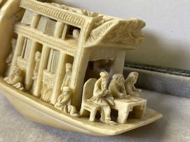 A Chinese pierced and carved ivory pleasure boat, 20th century