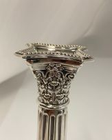 A pair of electroplated Corinthian silver candlesticks, 20th century