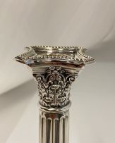 A pair of electroplated Corinthian silver candlesticks, 20th century