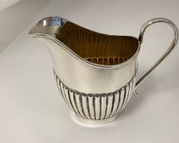 An Elizabeth II silver cream jug, E Viners, Sheffield, 1953
