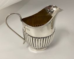 An Elizabeth II silver cream jug, E Viners, Sheffield, 1953