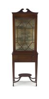 An Edwardian mahogany and inlaid cabinet-on-stand