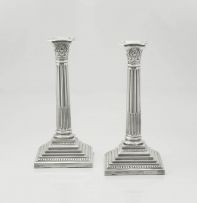 A pair of electroplated Corinthian silver candlesticks, 20th century