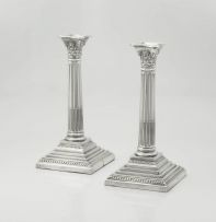 A pair of electroplated Corinthian silver candlesticks, 20th century