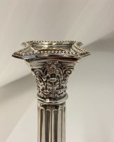 A pair of electroplated Corinthian silver candlesticks, 20th century