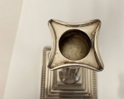 A pair of electroplated Corinthian silver candlesticks, 20th century