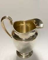A pair of Tiffany & Co silver water pitchers, 1947-1956, .925 sterling