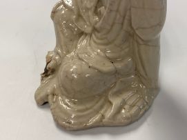 A Chinese creamy white-glazed figure of Guanyin, Qing Dynasty, 18th century